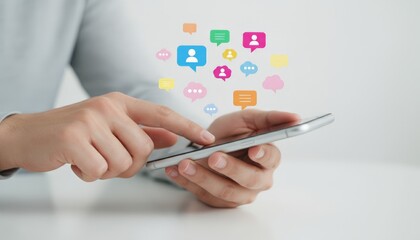 Person's hands interacting with a smartphone displaying various colorful chat bubble and user profile icons, representing online communication, networking, and digital connection