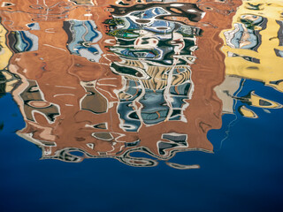 Water, sun, and reflections as abstract artists.