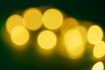 Multicolored holiday lights background with bokeh effect