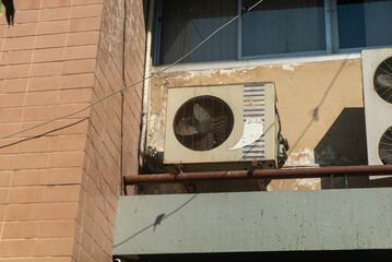 Weathered Air Conditioning Unit on Wall