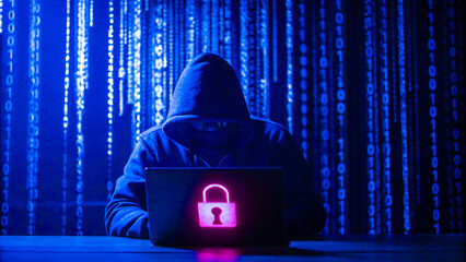 Hooded hacker with laptop displaying padlock and binary code background