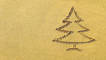 images christmas tree in the sand