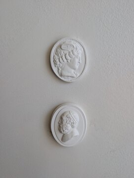 Greek figureheads on a wall