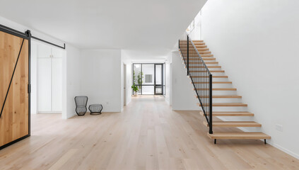 Fototapeta premium Modern interior with wooden staircase and light hardwood flooring