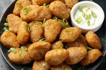 Crispy Jalapeno cheese bites with sauce. Party food snacks