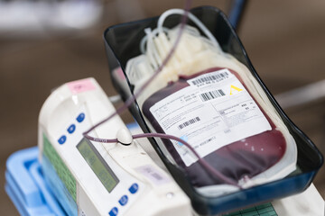 Blood bag in a blood collection mixer machine at blood donation center.Donation for emergency surgery and blood bank unit.Save life and medical treatment concept.