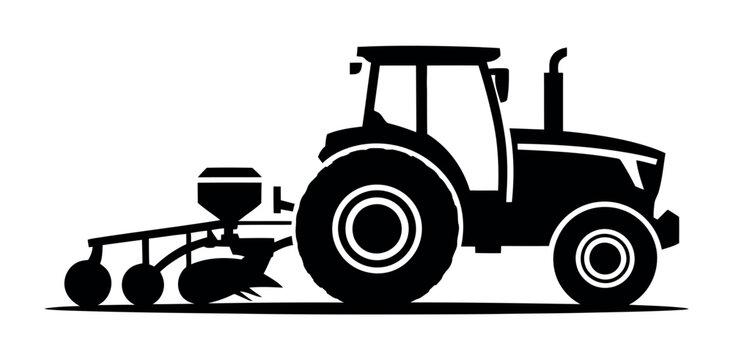 A silhouette of a tractor pulling a planter across a field.