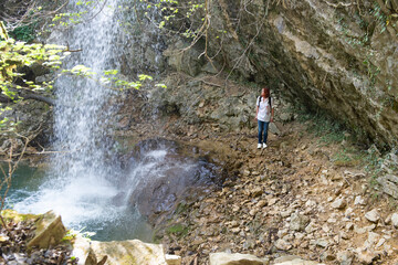 A woman visiting one of the many waterfalls on the Istrian peninsula in Croatia