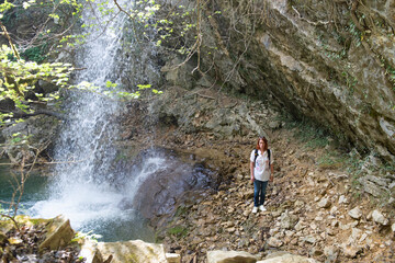 A woman visiting one of the many waterfalls on the Istrian peninsula in Croatia
