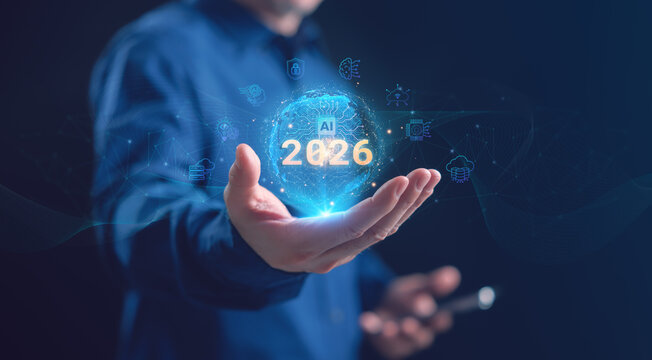 A businessman holding a glowing holographic AI globe with 2026 and artificial intelligence, cloud computing, neural network, and cybersecurity icons, representing future technology. AI trends in 2026.