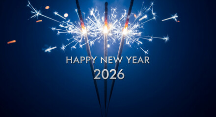 Obraz premium Image of sparkler with bright sparkles, displaying Happy New Year 2026 text against blue background, representing celebration, festive time and joyous mood