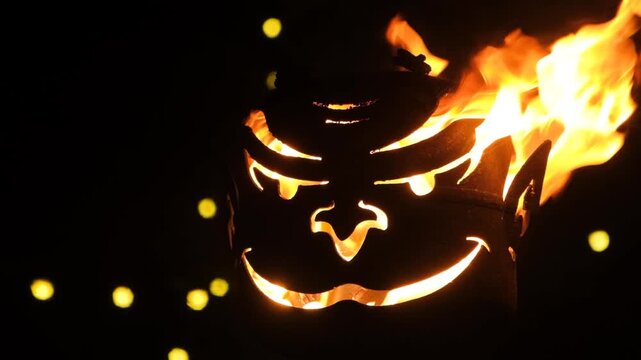 Krampus Festival Decoration. Scary Mask with Real Fire Flame Slow Motion