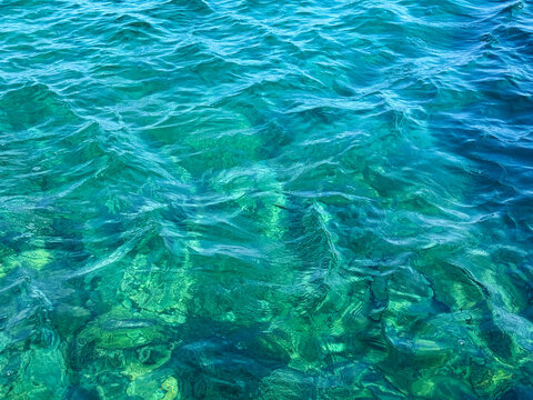 Clear ocean waves blue surface.