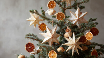  Christmas tree decorated only with paper stars and dried oranges, natural color palette.
