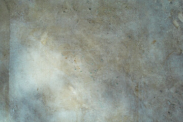 Old concrete surface with grainy texture and light stains under natural light