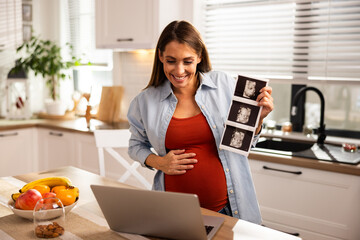 Pregnant Woman Showing Ultrasound On Video Call
