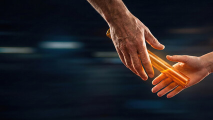 Passing orange relay baton between two hands in race, symbolizing teamwork and smooth transition