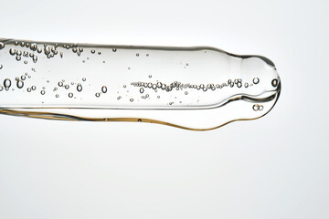 Cosmetic pipette dispensing serum with liquid bubbles