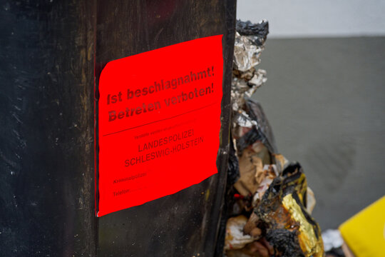 Red confiscation notice on damaged object issued by state authority