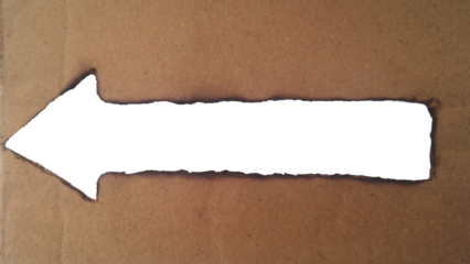 Burnt cardboard arrow cutout pointing left, abstract texture isolated on transparent background
