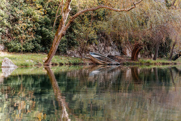 Scenic Monasterio de Piedra lake with boat and reflections
