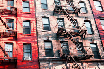 Colorful New York Tenement Facade With Fire Escapes