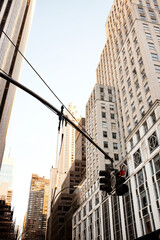 Urban Skyscrapers and Red Traffic Light at Golden Hour