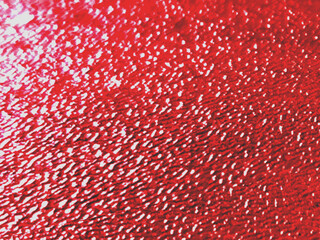 Red background featuring soft wooden texture