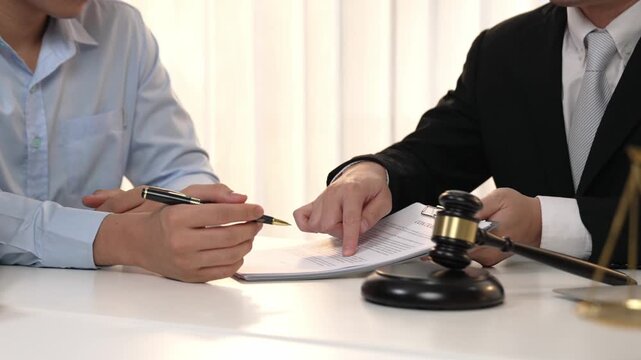 Couples file for divorcing and seek assistance from law firm to divide property after breakup. Obligations contract assist by lawyer in negotiating settlement agreement meeting. Slow motion. Rigid.