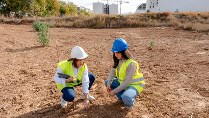 Architect and engineer analyzing construction site