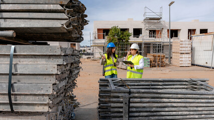 Architect and engineer discussing on construction site