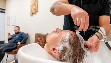 Hair wash and relaxation in a modern barbershop