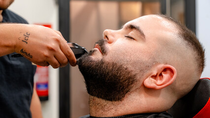 Skilled beard trim at modern barbershop