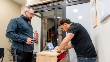 Customer waiting at the barbershop reception