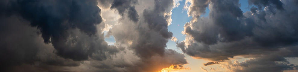 Fototapeta premium Panoramic seascape with dramatic stormy sky and sun rays