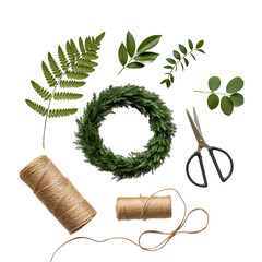 Diy wreath making supplies including greenery scissors twine and a wreath form