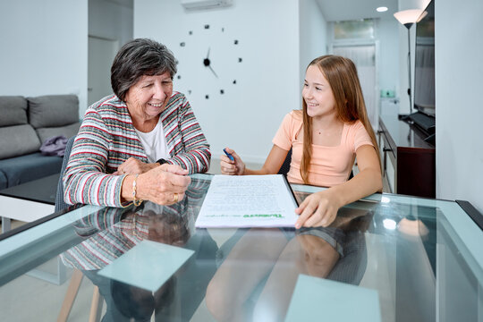 Grandmother and teenager share quality time at home