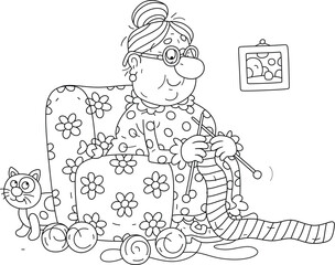 Cute granny with a funny cat sitting in her cozy soft armchair and knitting a long striped scarf for a long cold winter, black and white vector cartoon illustration for a coloring book
