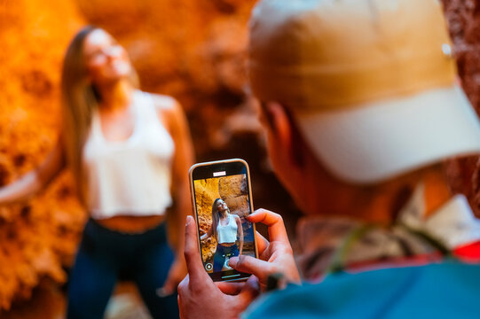 Couple capturing adventure at Red Canyon, Spain