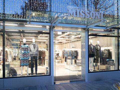Missoni luxury fashion boutique storefront in Fidenza Village, Italy, during Christmas holiday shopping season