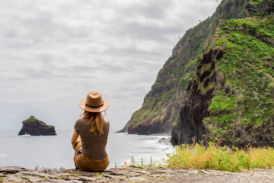 Woman admiring ocean view at ruins of san Jorge, Madeira