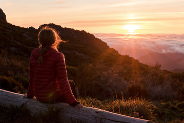 Woman enjoying sunset view in Madeira