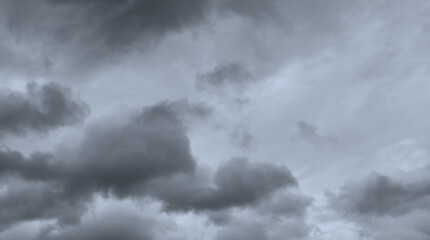 Dark storm sky with dramatic fluffy clouds. Cloudscape rainy season. Thunderstorm climate weather. Pollution smoke PM 2.5 Cabo dioxide concept. Scary Halloween.