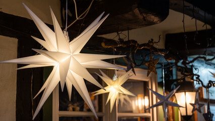 White Christmas stars in fron of a half-timbered house