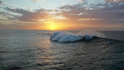 I watch the waves and contemplate the sunset by the sea