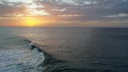 I watch the waves and contemplate the sunset by the sea