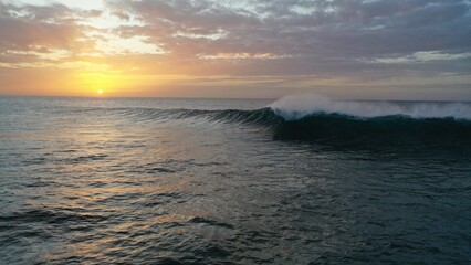 I watch the waves and contemplate the sunset by the sea