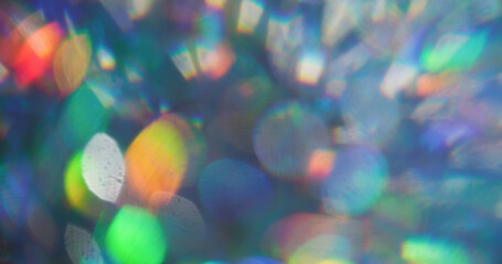 Defocused circles. Sparkling texture. Purple orange neon colorful round vibrant gleam radiant rainbow light on abstract bokeh art background.
