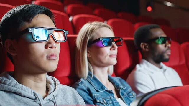 Enthralled audience in 3d glasses watching dynamic action movie. capturing the excitement of immersive cinema experience.