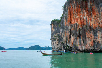 Beautiful tropical landscape, Andaman sea and islands near Phuket in Thailand. James Bond or Khao Phing Kan Island and Boats on sea water